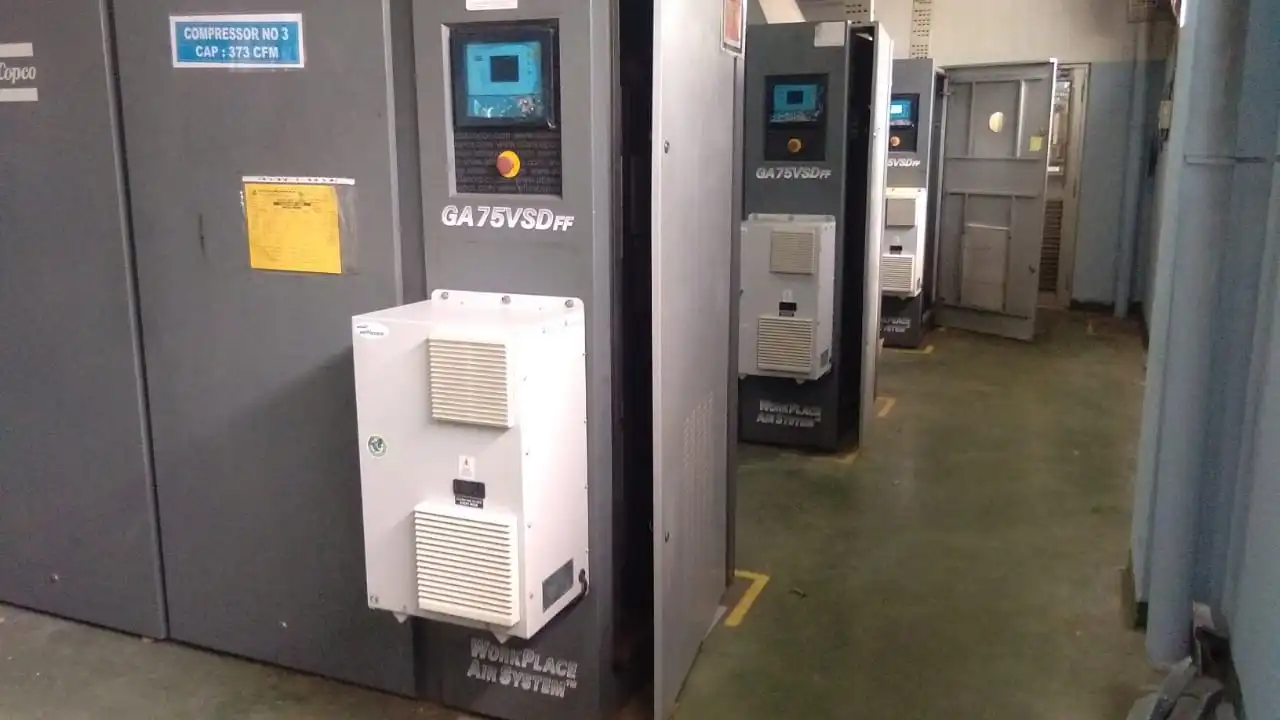 Adhunik Powertech Panel AC unit installed on an industrial compressor