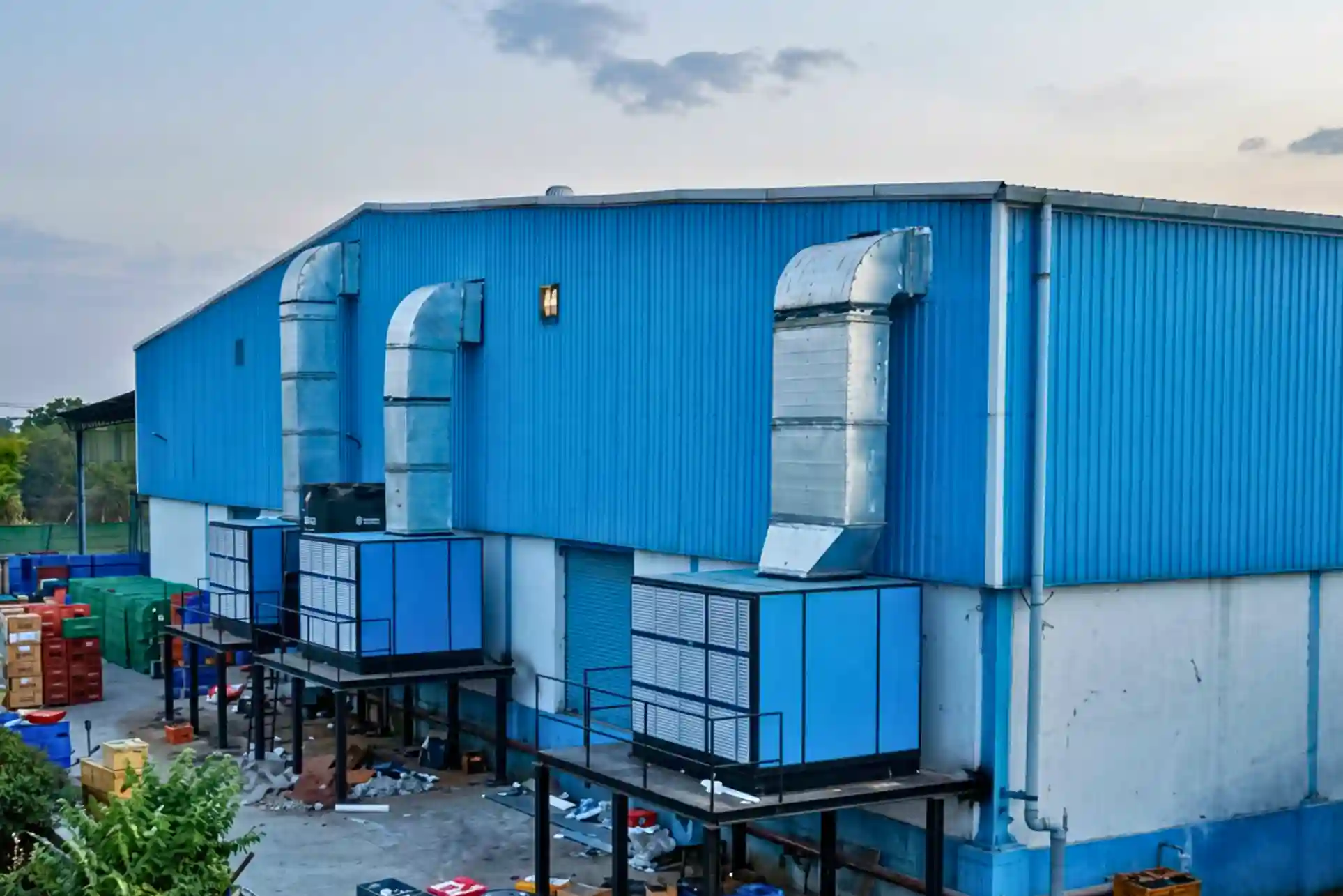Air washer units with ducting installed at factory exterior for industrial air cooling system